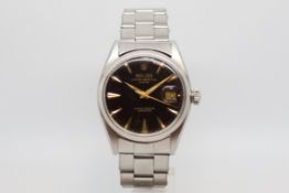 Rare Gloss Dial Rolex Oyster Date Chronometer Wristwatch, circular black gloss dial with gold