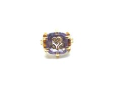 An unusual rose cut diamond inlaid amethyst, six claw set in a decorative mount, with engraved
