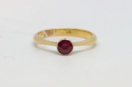 Single stone ring, round cut ruby, rub over set in 22ct yellow gold