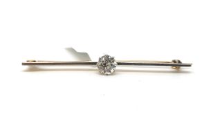 Diamond bar brooch, set with a single old cut diamond weighing an estimated 0.65ct, mounted in white