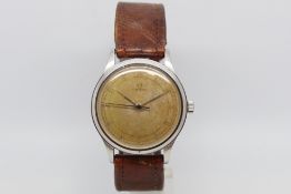 Gentlemen's Omega Vintage Watch, circular heavy patina dial with arabic numerals and a outer
