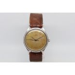 Gentlemen's Omega Vintage Watch, circular heavy patina dial with arabic numerals and a outer