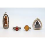 A selection of silver items including 2 reliquaries, a carved agate ring and another agate ring,