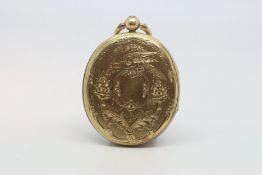 Edwardian locket, oval, engraved floral design, with hair locket inside, measures 40 x 30mm