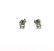 Pair of single stone diamond earrings, round brilliant cut diamonds weighing an estimated total of