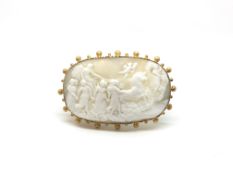 A carved cameo brooch, elongated oval cameo depicting 'Aurora of the dawn', with gold beading to the