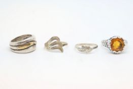 Selection of four silver rigs, including gem set, approximately 20g gross