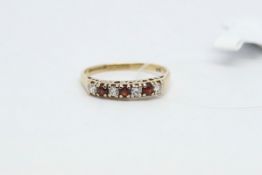 Red and white cubic zirconia half eternity ring, with 'I love you' carved in the gallery, in 9ct