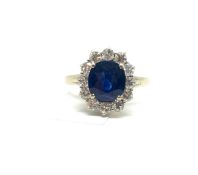 French sapphire and diamond cluster ring, oval cut sapphire weighing an estimated 2.00ct, surrounded