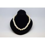 Single row pearl necklace, 7-8mm cultured pearls, strung knotted with a 9ct yellow gold clasp,