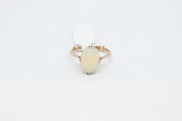 Single stone opal ring, oval cabochon opal measuring approximately 13.2 x 10mm, set in 9ct yellow