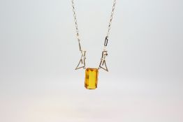 A citrine and pearl necklace. The large citrine measuring 2.4cm x 1.3cm. Chain stamped 375.