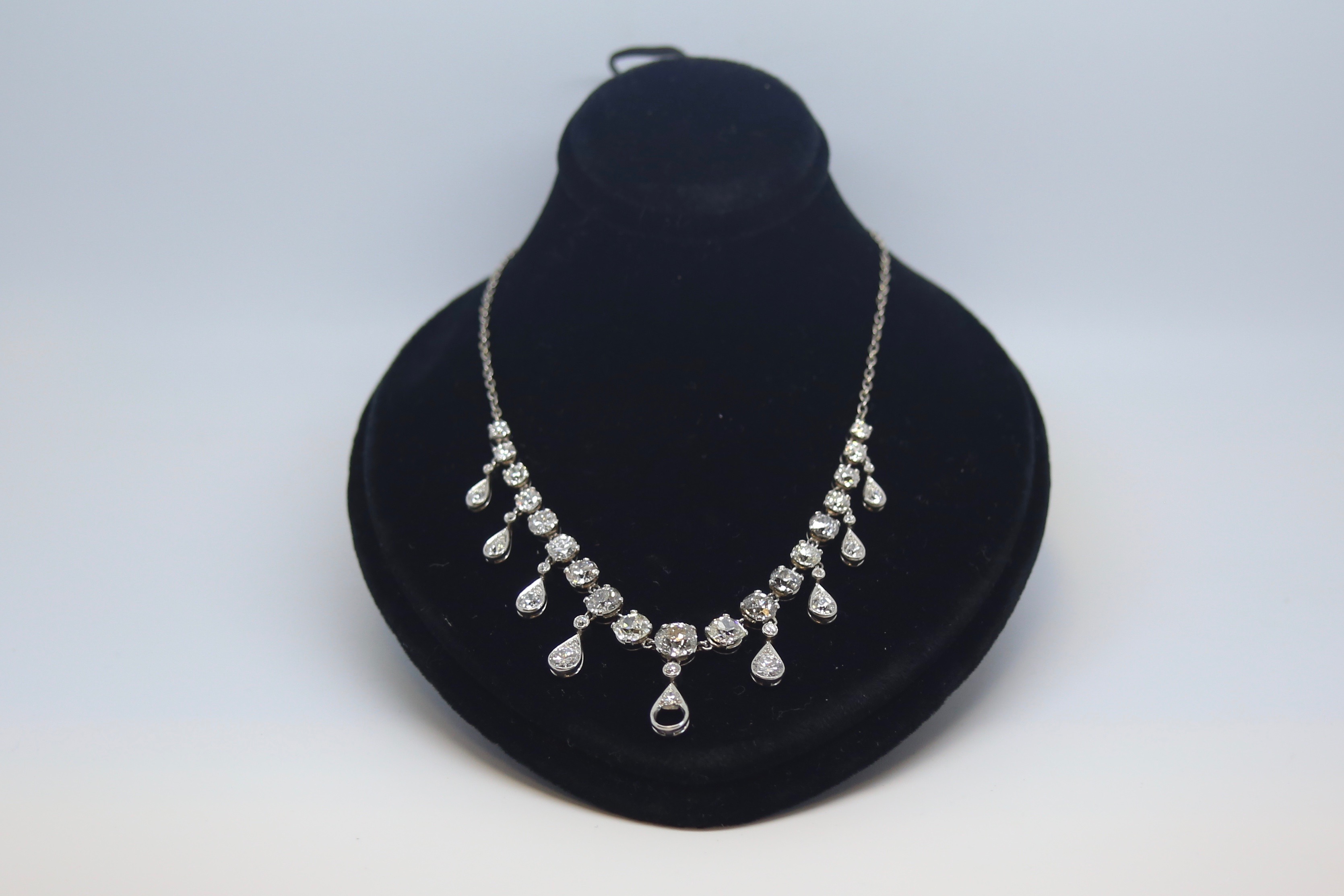 Old cut diamond riviere necklace, graduating old cut diamonds four claw set, 0.10ct to approximately