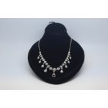 Old cut diamond riviere necklace, graduating old cut diamonds four claw set, 0.10ct to approximately