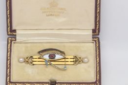 Antique Egyptian revival Eye of Horus brooch, red cabochon centre with white, black and blue enamel,
