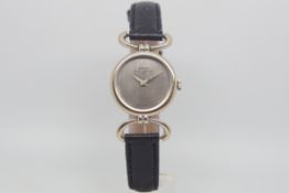 Ladies 18ct Baume & Mercier, silvered dial, 24mm 18ct case and lugs, black leather strap