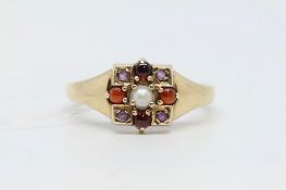 Multi gem set cluster ring, central split pearl surrounded by cabochon cut garnets and round cut