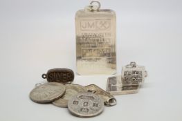 Selection of eight silver ingot/coin pendants including a Johnson Matthey 5oz pendant, approximately