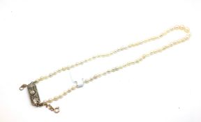 Single row, freshwater pearl necklace, pearls measure approximately 3.5-6mm, strung knotted on a