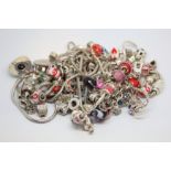 A selection of silver charm bracelets and charms including Chamilia