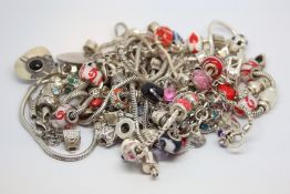 A selection of silver charm bracelets and charms including Chamilia
