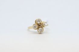 A four stone old cut diamond ring. The old cut diamonds weighing approximately 1.30cts. In a