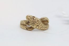 Gem set snake ring, engraved coiled snake with ruby eyes, mounted in 9ct yellow gold