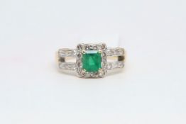 Emerald and diamond ring, 5.8 x 5mm emerald, set in a cluster of diamonds, in yellow and white gold,