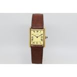 Cartier Tank, rectangular dial with roman numerals, 24mm rolled gold case with saphire in the crown,