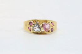 Gem set cluster ring, centrally set with a pink and a blue stone set hearts with ruby details to the