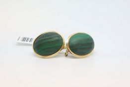 Malachite earrings, oval cabochon cut malachite in a yellow metal border with post and clip fittings