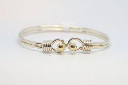 Tiffany & Co silver bangle, 18ct ball clasp, signed and hallmarked, with a Tiffany pouch