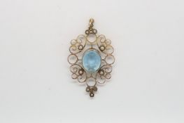 A blue pendant with seed pearls in yellow metal.4.5cm including bail. 4.4g