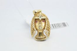 14 ct yellow gold Egyptian goddess pendant set with ruby eyes and an emerald to the head, measures