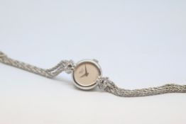 Ladies 18ct and diamond Chopard cocktail watch, circular dial with diamond set lugs, three strand