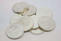 Selection of nine silver coins, including seven Brittania fine silver coins and two Republic of