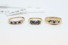 Three Rings, including a sapphire and cubic zirconia set cluster ring, round cut sapphires and cubic