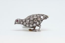 Early 20th C diamond set pheasant brooch, old cut diamonds with ruby set eye, approximately 25 x