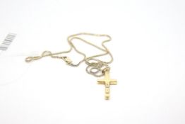 18ct yellow gold cross pendant, on a 9ct brick link chain, weighing approximately 6.5g