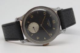 Gentlemen's Vintage Longines Oversized Wristwatch, circular black dial with gilt baton and arabic