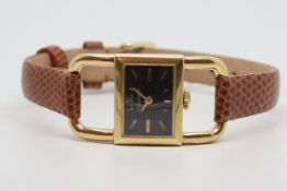 Ladies Jaeger Le Coultre 18kt Gold Wristwatch, rectangular black dial gold baton hour markers, in
