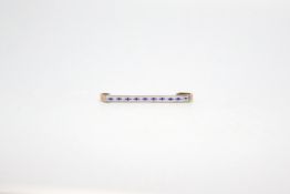 Enamel bar brooch, tested as 9ct, with blue and white enamel detail, weighing approximately 2.0g