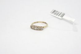 Five stone cubic zirconia ring, carved half hoop in 9ct yellow gold, weighing approximately 1.9g