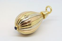 A tri-colour gold and sapphire set pendant, large pear drop pendant with cabochon sapphire, in