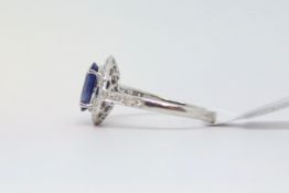 Art Deco style sapphire and diamond ring, oval cut sapphire measuring 9 x 6.5mm, in a round