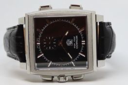 Gentleman's Tag Heuer Monaco 69 Wristwatch w/ Paperwork, square black dial with baton hour markers