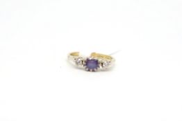 Sapphire and diamond three stone ring, central oval cut sapphire 6x5mm claw set between two