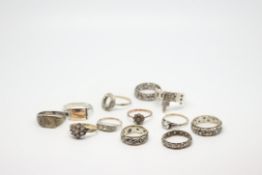 A quantity of mostly silver and 9ct rings three stone paste rings, singles stone rings,