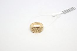 18ct yellow gold keeper ring, weighing approximately 8.4g