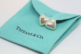 A pair of Tiffany & Co silver heart earrings, marked Tiffany & Co, 925 Mexico, no backs
